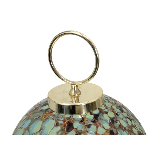 A pair of vintage table lamps dating back to the 1970s/1980s, featuring an elegant polished brass frame with a decorative...