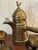 This vintage Turkish coffee pot features etched brass, a bird topper, and a long handle. Includes 5 small brass cups. A...