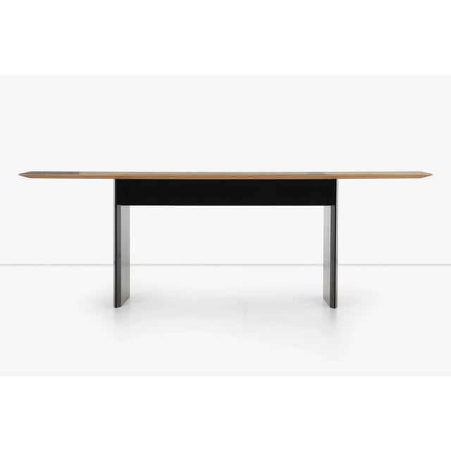 Giovanni Offredi for saporiti dining table in birdseye maple, with marquetry abstract designs on the surface.