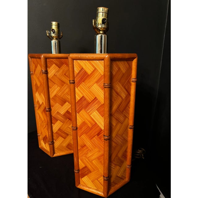 Pair of herringbone parquet rattan and bamboo lamps with a fun hexagon shape. Bamboo trim on the sides and beautiful...