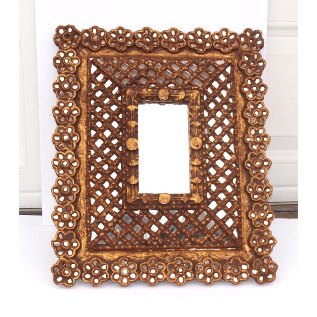 An antique true Spanish mirror in the Moroccan style. Mirror is a raised pyramid shape. Over 300 small mirrors are inset...