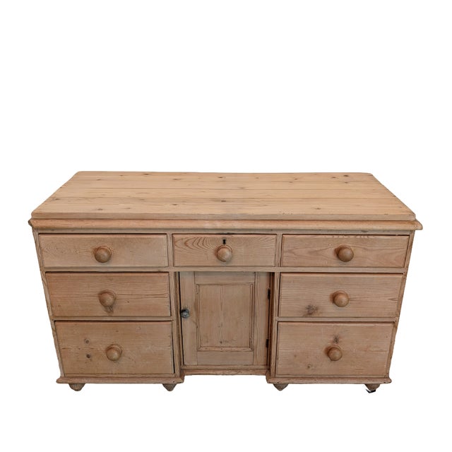 Approximate Dimensions: 55.75" Wide, 22.5" Deep, 32.75" Tall A lightly colored English pine sideboard. This piece is...