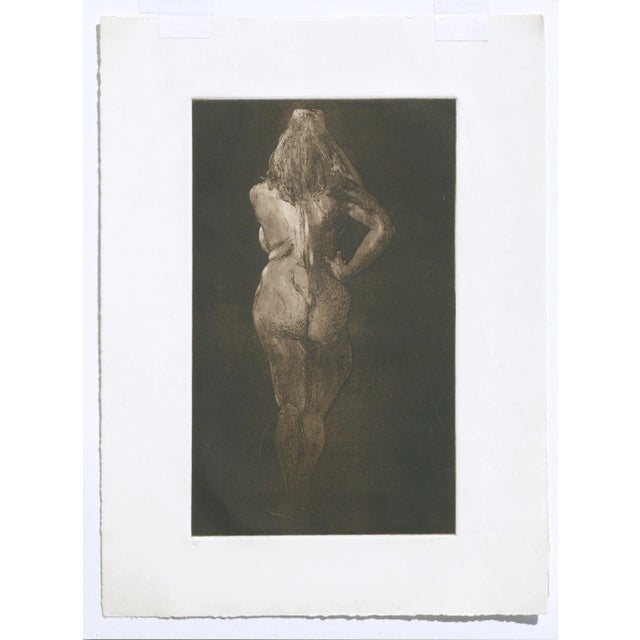 Limited edition drypoint etching of a nude figure from a posterior view by Jim Smyth (American, b. 1938). Numbered and...