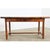 A 19th century farmhouse table, whose robust design is a practical solution for the modern kitchen to pivot between dining...