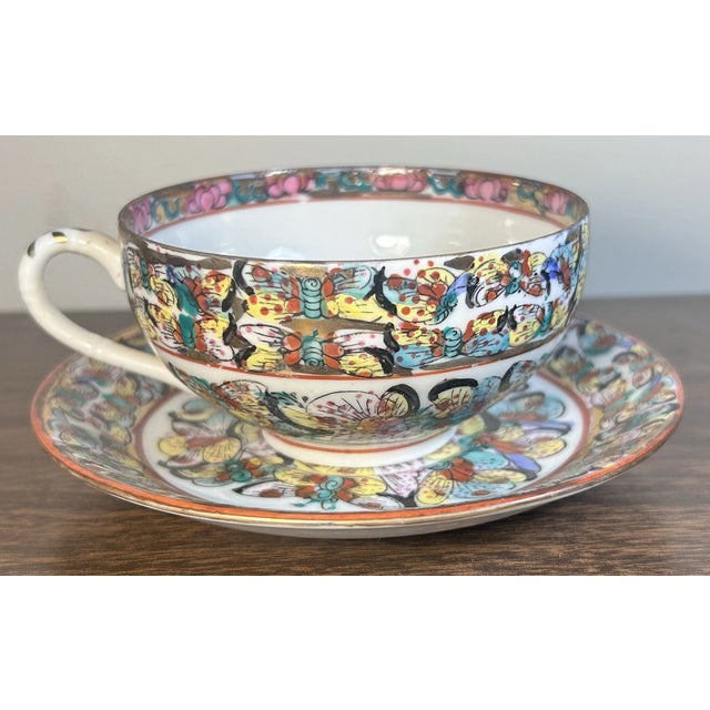 This is a Vintage 1970’s Chinese Export Porcelain Thousand Butterflies Teacup and Saucer. The teacup measures 2 1/8” tall...