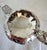 A substantial george iv sterling silver cream or milk jug, hallmarked in london for 1823 and richly decorated with hand-...
