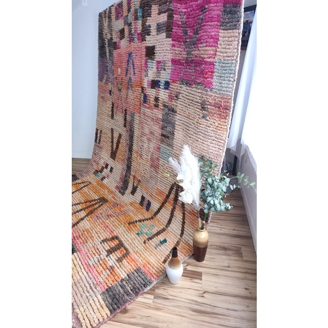 One-of-a-kind handwoven Moroccan rug in plush high-pile wool. A patchwork Boujaad in blush pink and turquoise — a hot-air-...