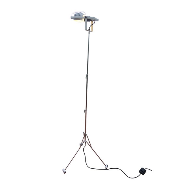 Claude replied: This iconic Italian floor lamp, the "Sintesi Nomad," was designed by Ernesto Gismondi for Artemide and...