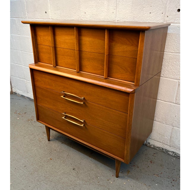 A beautiful example of classic American mid-century modern design, this Kent Coffey "Eloquence" Highboy Dresser combines...