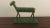 This is a wonderful piece of American Folk Art. This great little horse is painted green and has a 6 painted on his back...