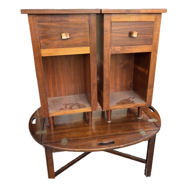 MCM Bedside Tables in a Walnut Finish with a Drawer and shelf on each along with a copper finish Pull .Bottom shelf is...