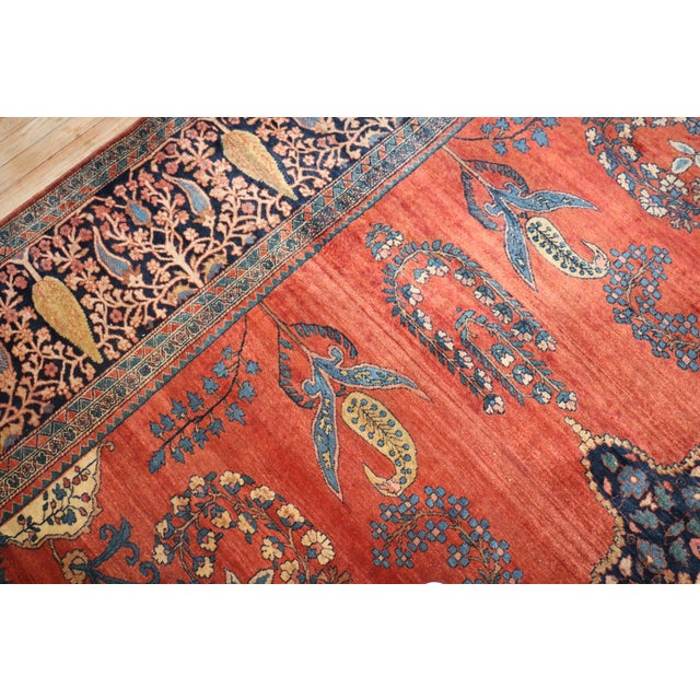 A turn of the 20th century Persian Sarouk Ferehan square room size rug. Measures: 10'7'' x 12'9'' The finely woven antique...