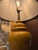 gorgeous midcentury baluster ginger jar vase lamp in mustard color with a wooden base and an added contemporary shade.