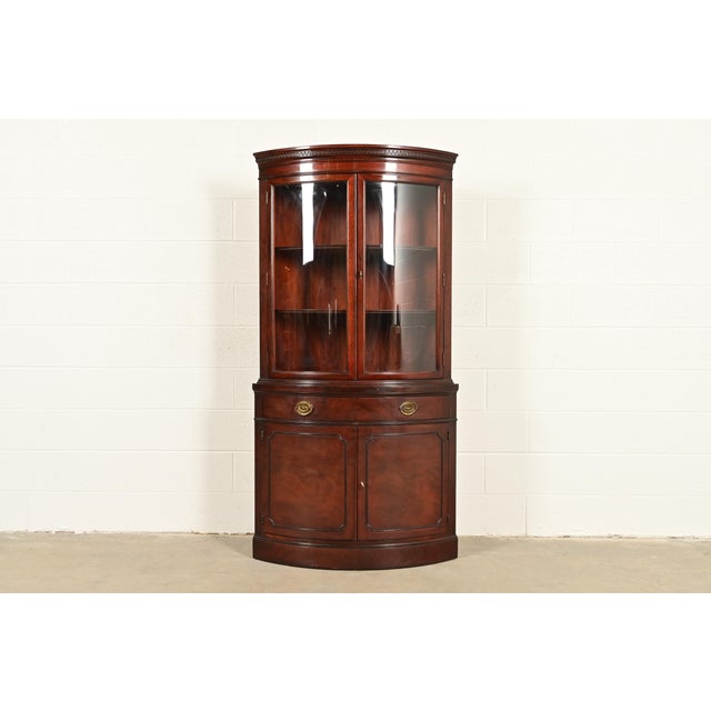 A gorgeous Georgian or Chippendale style bow front corner bar cabinet, dining cabinet, or display cabinet By Drexel, "New...