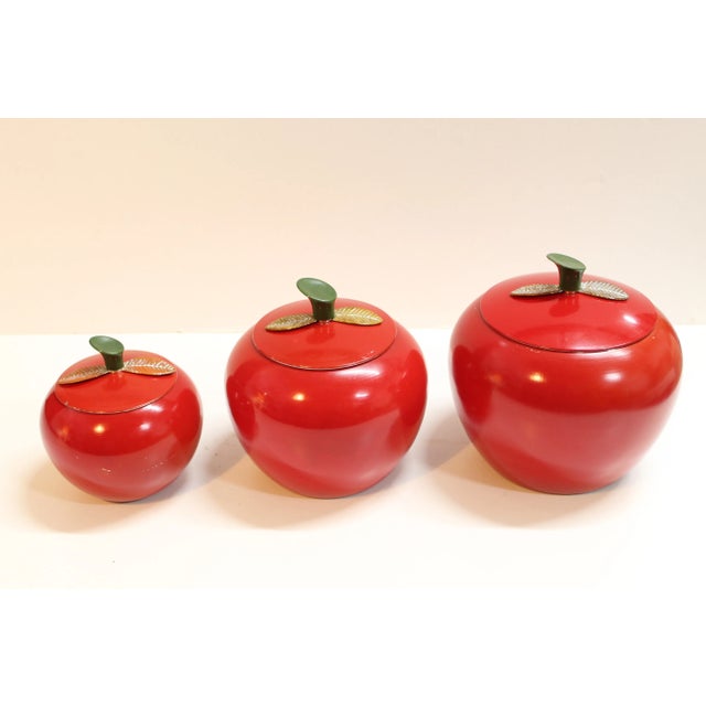 1960s spun aluminum canister set shaped like red apples. 6 pieces (3-lids & 3 canisters) with clean interiors and minor...