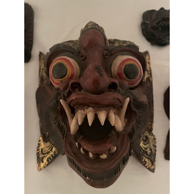 An exceptionally sculptural and deeply textured collection of five mid-to-late 20th-century hand-carved wood figures,...