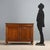 Walnut cupboard. Drawer in the molded band under the top, pair of paneled doors, front legs replaced. Fir interior. Italy,...