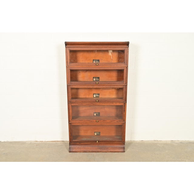 A beautiful antique Mission or Arts & Crafts period "Viking" five-stack barrister bookcase cabinet In the manner of Globe...