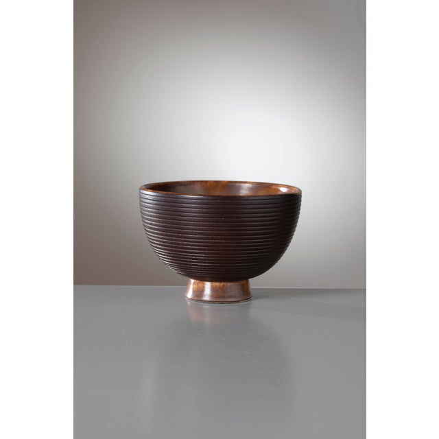 An elegant and highly sophisticated modernist ceramic bowl, designed by the acclaimed master Giovanni Gariboldi for the...