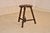 Late 19th century carved oak tripod stool from France. the top has a beveled and hand carved edge surrounding a hand...