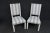 A pair of Ethan Allen side chairs , shabby chic style , white painted frames with off white and blue stripped fabric
