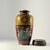 This is a striking Meiji-period Japanese cloisonné enamel vase, richly detailed with colorful panels of phoenix and dragon...