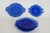 This lovely Set of 5 Plates is made of glass. Each plate features a double shield handle design, a cobalt blue color to...
