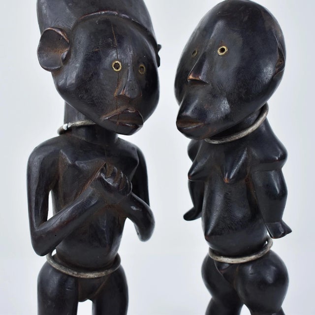 A lovely pair, carved by the Zande. The Zande are a Central African people who speak a language from the Adamawa-Ubangi...