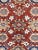 This antique Ferehan design area rug, crafted from high-quality wool, features a rich rust color that adds warmth and...