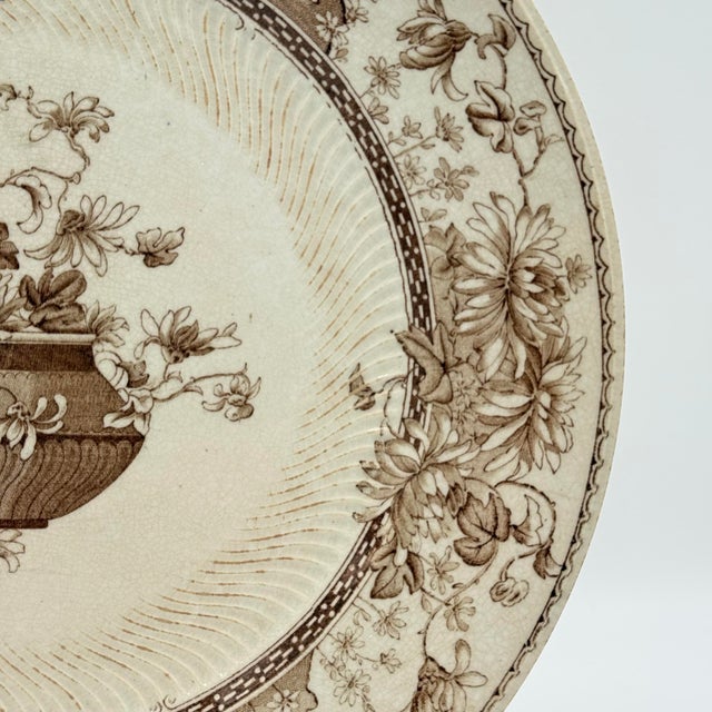 An elegant antique English transferware plate by Doulton’s Burslem, produced in the late 19th century, featuring the...