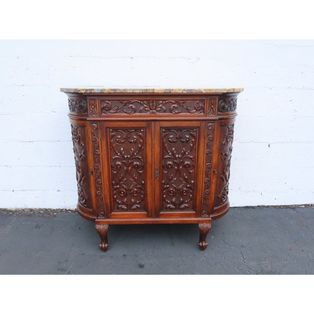 This wonderful French Commode is made of solid wood, walnut, and marble. The sideboard has a French style and design made...