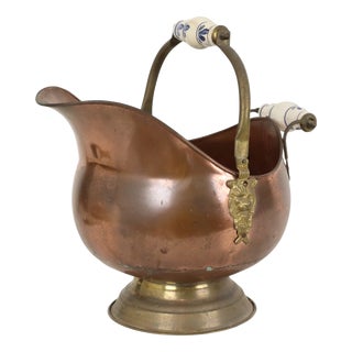 Antique Copper Helmet-Shaped Coal Scuttle with Lion Heads and Delft Ceramic Details For Sale