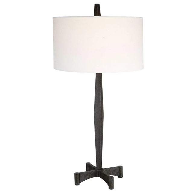 Inspired By Classic Metalwork Designs, This Table Lamp Features A Tapered Base And An Industrial Inspired Foot Finished In...