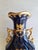 Vintage French style cobalt blue gold ornate porcelain vase. The scene depicting a romantic scene with a gentleman playing...