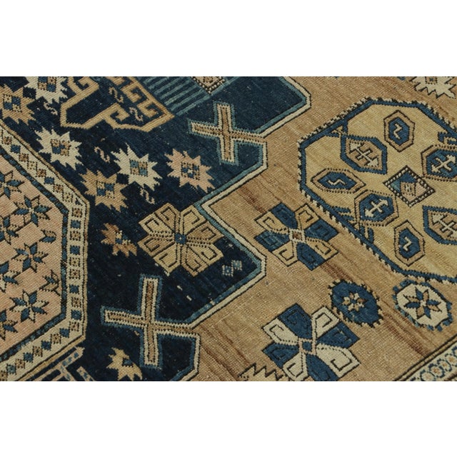 Hand-knotted in wool and originating from Russia circa 1910-1920, this 4x5 antique rug of Kuba provenance is the latest...