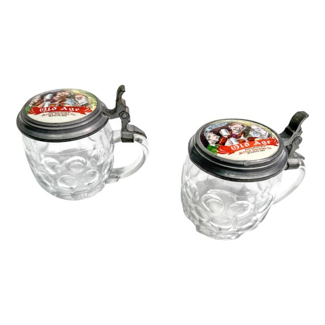 Antique Pre-Prohibition Jetter Brewing Co Old Age Glass Lidded Beer Steins, South Omaha Nebraska Brewery Advertising c.1902–1914 - Set of 2 For Sale