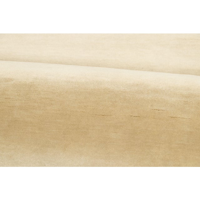 Hand-knotted in wool, this 3x7 contemporary runner captures the serene, impressionistic grace of Chinese Deco textile...