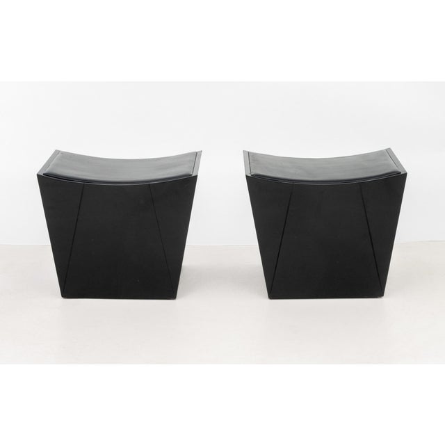 Pair of Modern Black Lacquered Ottomans, with black leather inset top. 17.75" H x 21.75" W x 17.5" D. Provenance: From a...
