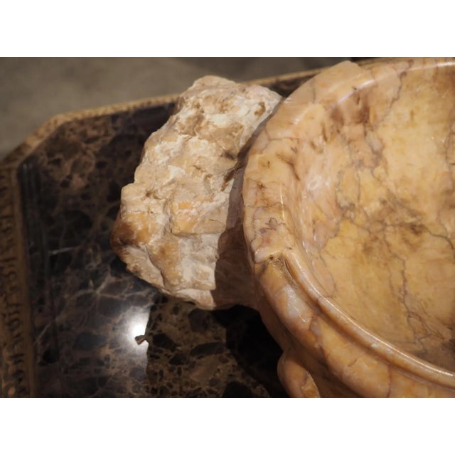 Hand-carved in Italy, this circular lobed marble font basin would make a great vide-poche. A vide-poche (literally “empty...
