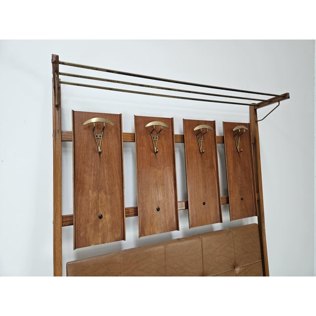 Vintage 1950s Italian-made wall coat rack, designed for elegant and sophisticated spaces. Thanks to its modern and...