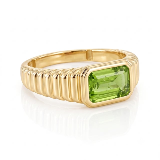 Radiate vibrant green energy with this chic gemstone cocktail ring. Plated in high-shine 18k yellow gold, this ring...