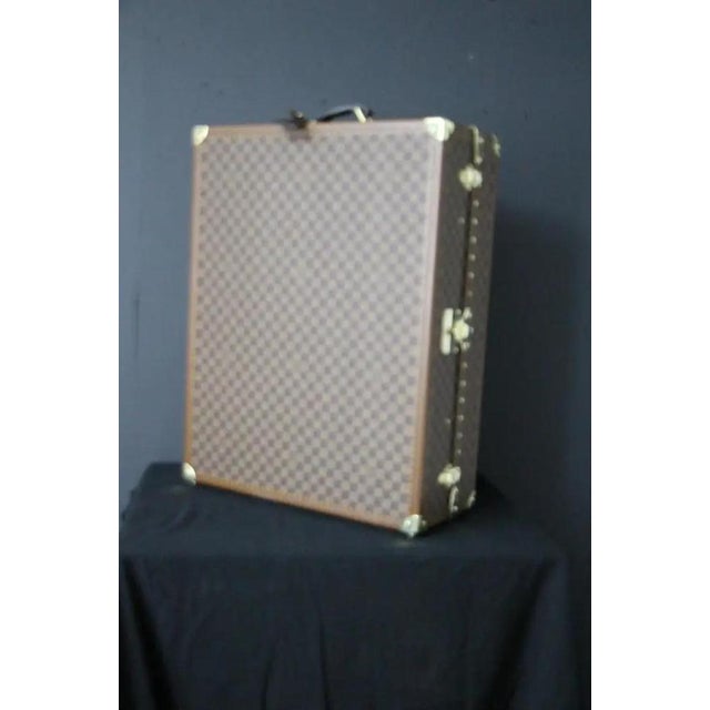 This trunk was a special order made in 2000's. It features checkers canvas, stamped LV solid brass locks, corners and...