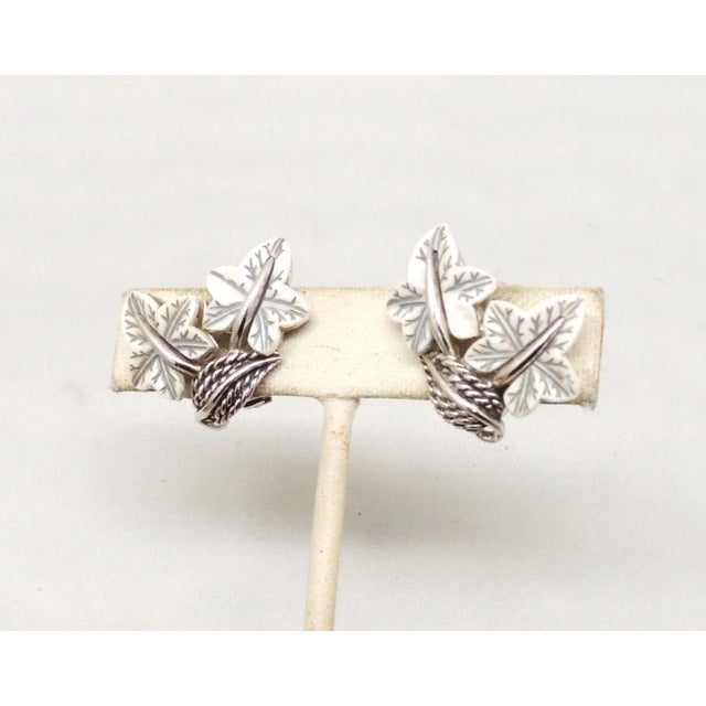 Metal Vintage Signed Boucher Rhodium Plated White Thermoset Leaves Clip Earrings - 2 Pieces For Sale - Image 7 of 9