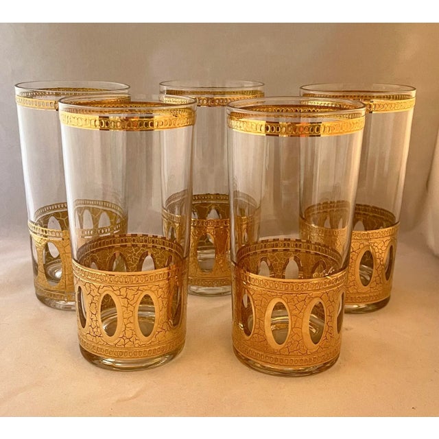 • Set of 5, gorgeous Culver highball glasses. • Pattern is "Antigua": 22K-gold overlay banded base with ovals cut out of...