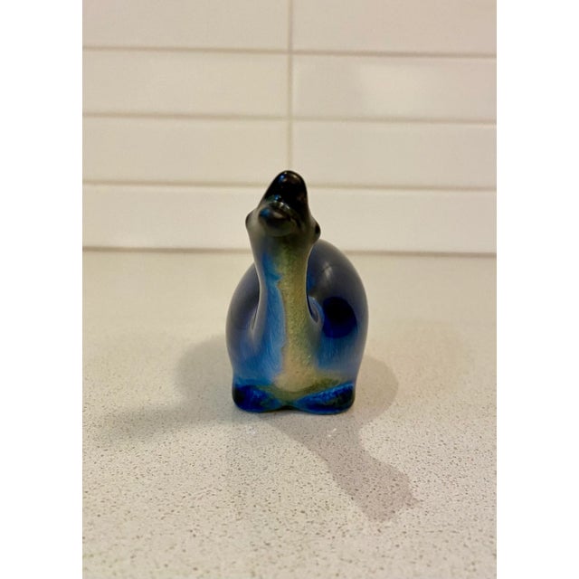 The striking blue glaze is a standout for this pair of ceramic geese that have been hand-signed by the artist. Born in...