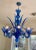 Murano Style Glass Chandelier hand blown in magnificent blue glass. 8 Lighted arms, 8 Leaves, and glass middle tower make...