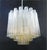 Vintage Italian chandelier with clear and yellow amber Murano glass tubes / made in Italy, circa 1960s in the style of...