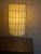 A pair of vintage mid-century modern wire cage table lamps attributed to Paul Mayen for Habitat. They feature cylindrical...