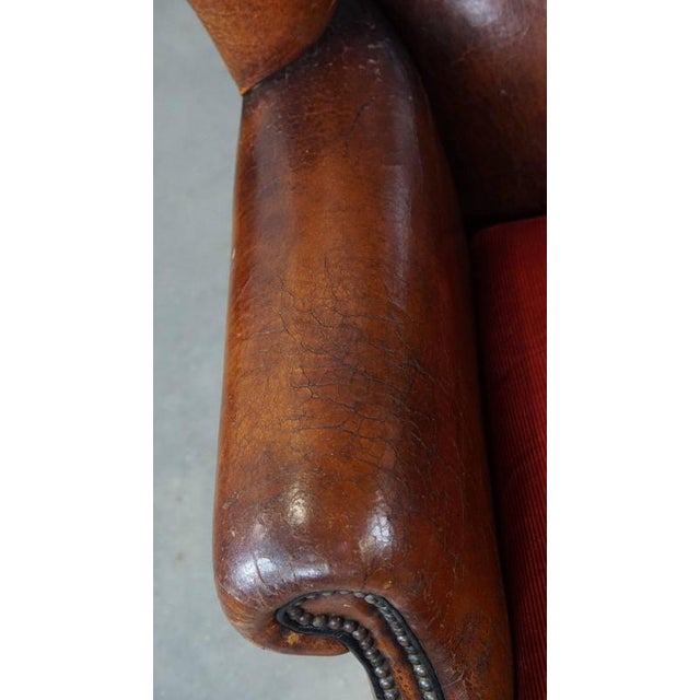 Textile Vintage Leather Wing Chair with Red Corduroy Seat Cushion For Sale - Image 7 of 14