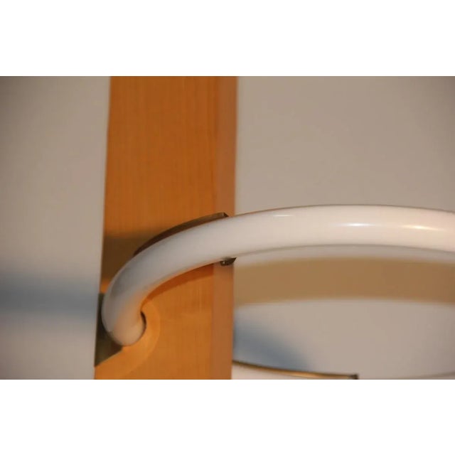 This Italian ceiling light from 1980 was designed in a style reminiscent of Carlo Scarpa. The neon piece features a...